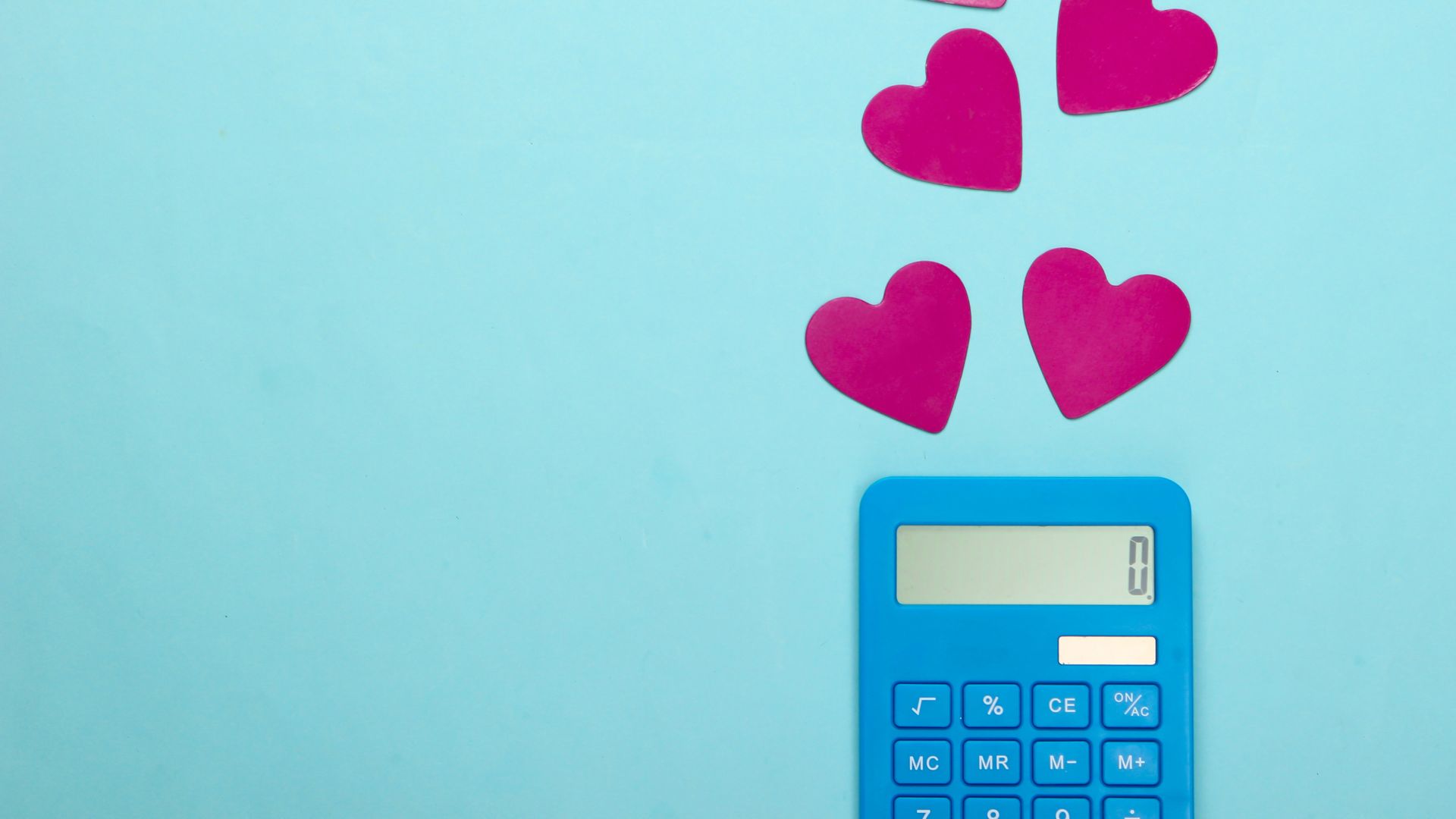 Calculator with hearts on a blue background