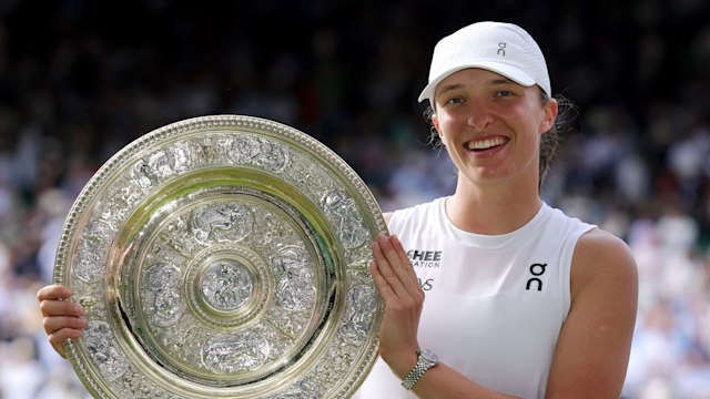 Iga Swiatek of Poland poses for a photo with the Ladiesâ Singles Trophy following her victory against Amanda Anisimova of United States during the Ladies' Singles Final on day thirteen of The Championships Wimbledon 2025 at All England Lawn Tennis and Croquet Club on July 12, 2025 in London, England. (Photo by Julian Finney/Getty Images)