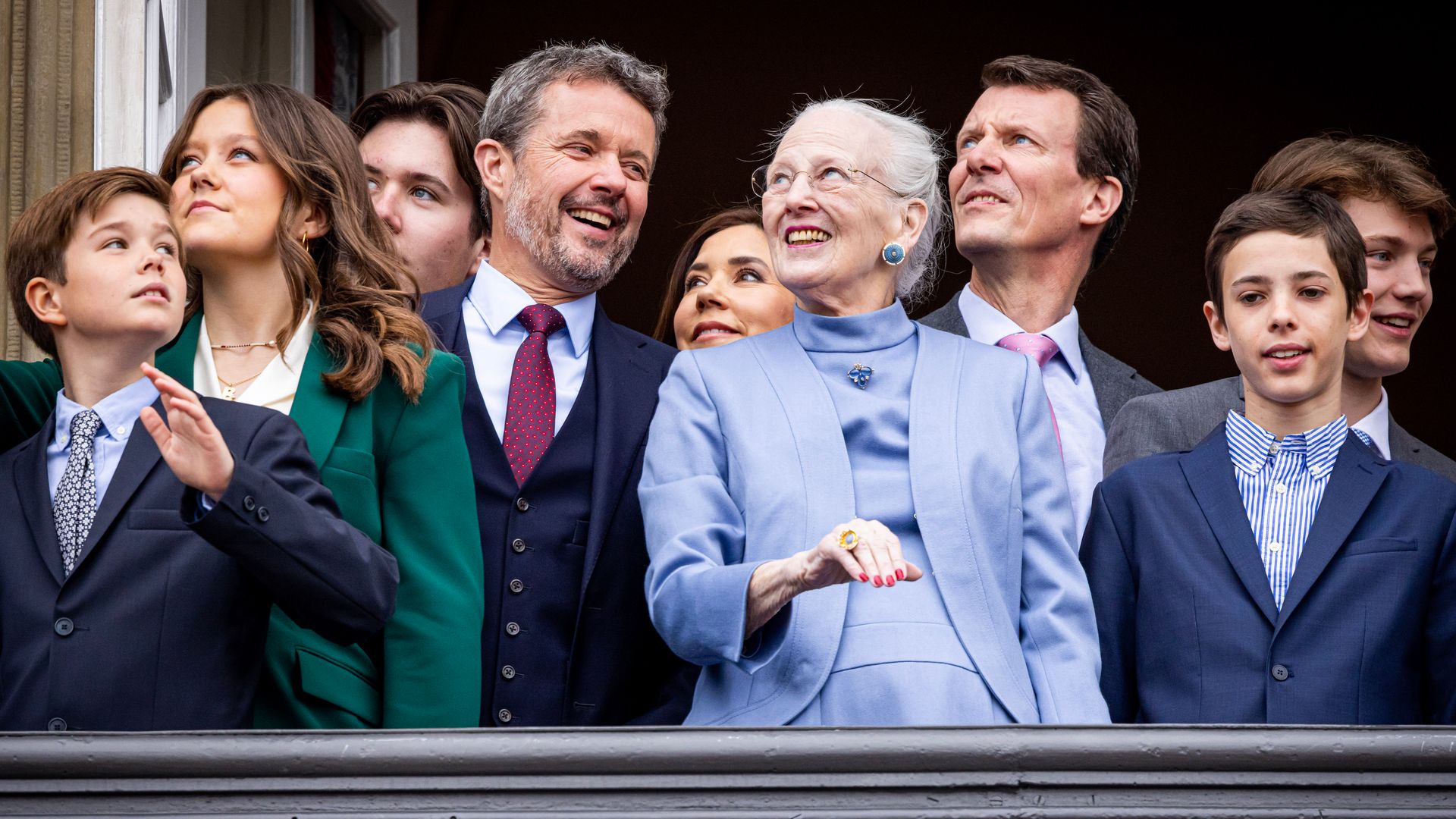 Queen Margrethe standing with Crown Prince Frederik, Prince Joachim and younger members of the Danish royal family