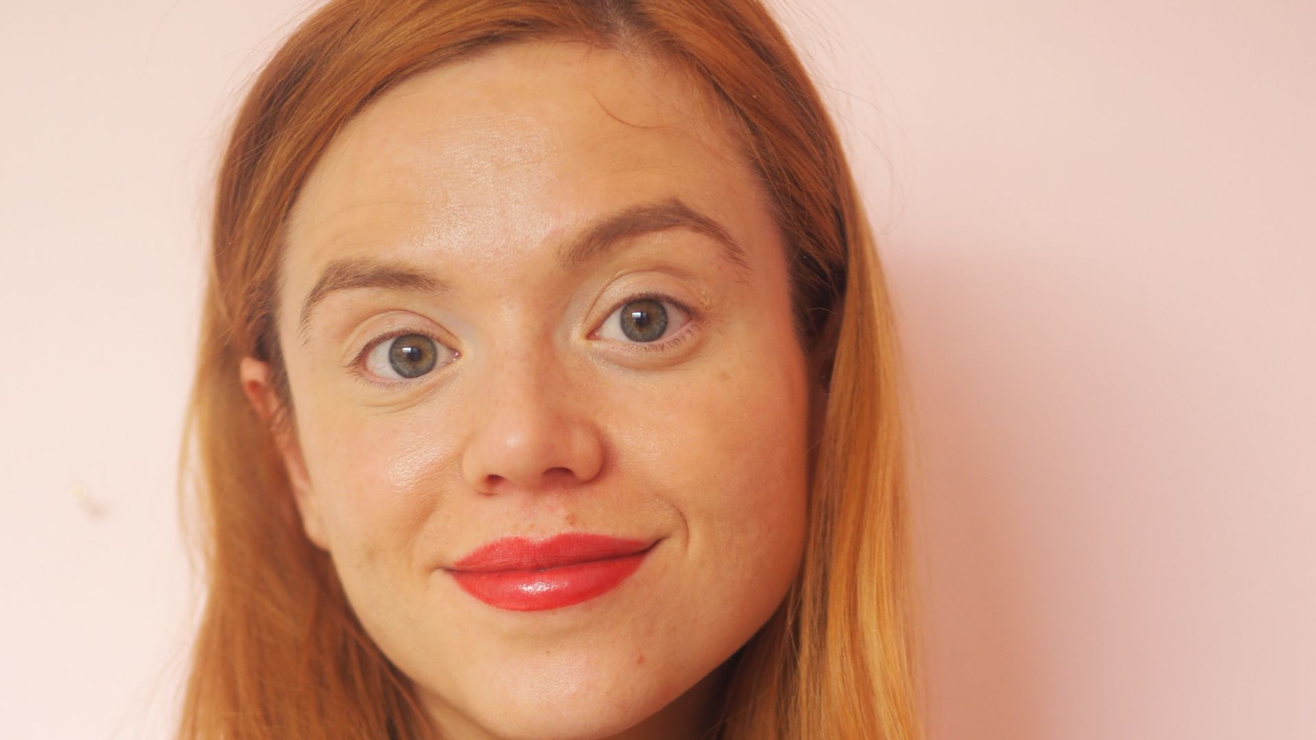 Headshot of Lola Biggs, dietitian at Together Health, wearing white jumper and smiling at camera
