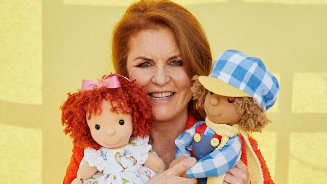 Sarah Ferguson holding dolls