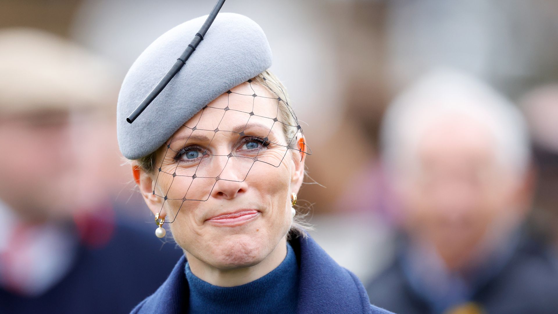 Zara Tindall in a blue coat and matching teal beret