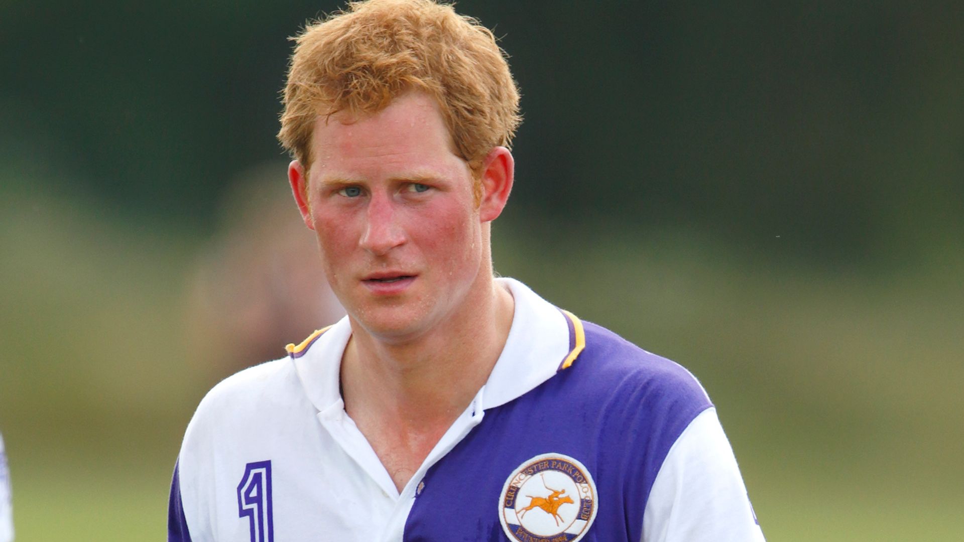 Prince Harry attends the prize giving after playing in the Jerudong Trophy polo match at Cirencester Park Polo Club on July 14, 2013 
