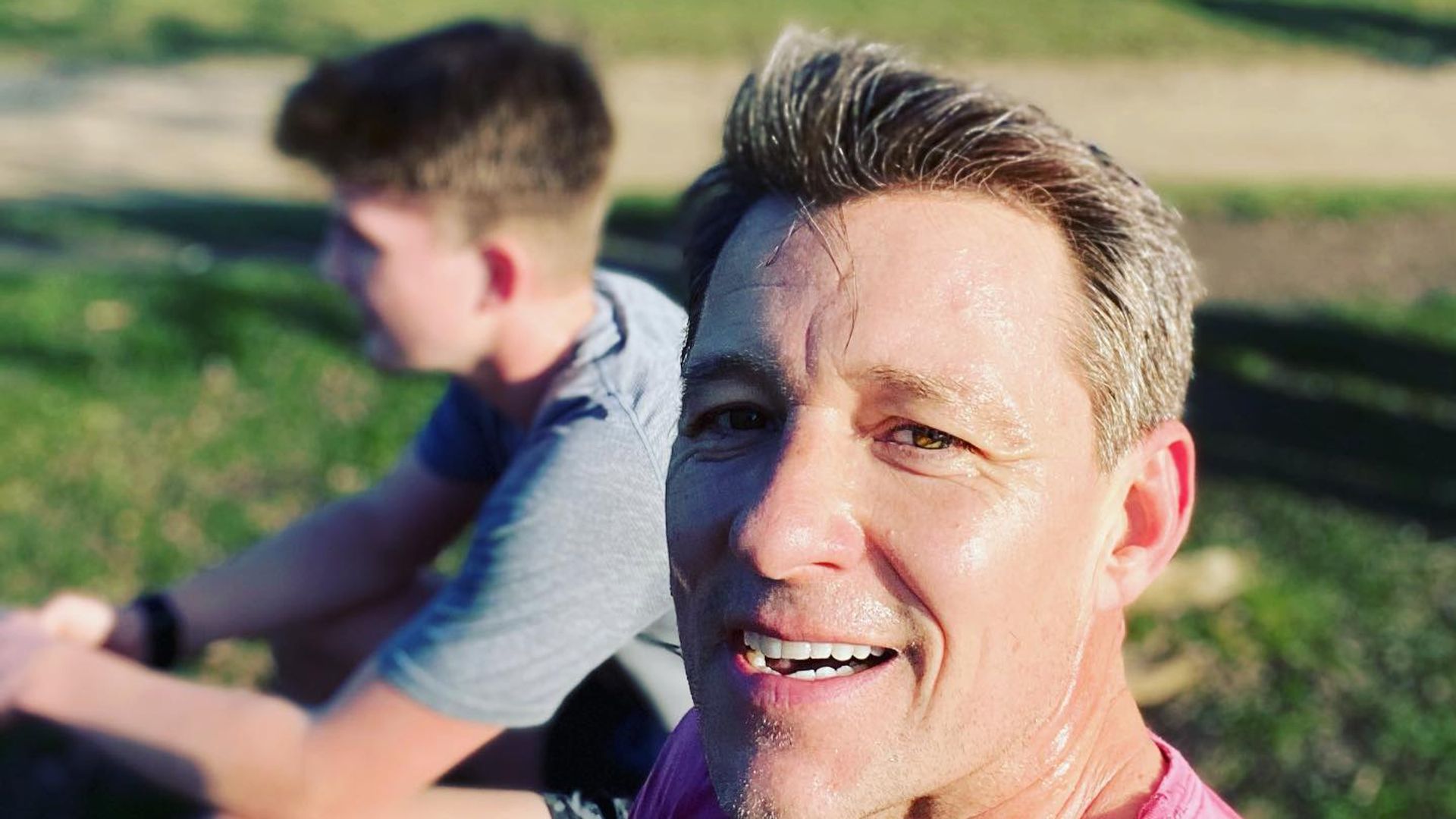 father taking selfie with son