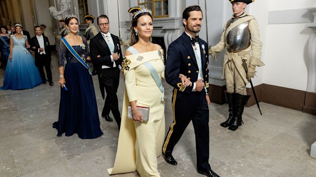 Princess Sofia walking arm in arm with Prince Carl Philip. Crown Princess Mary, Prince Daniel, Crown princess Victoria are behind them