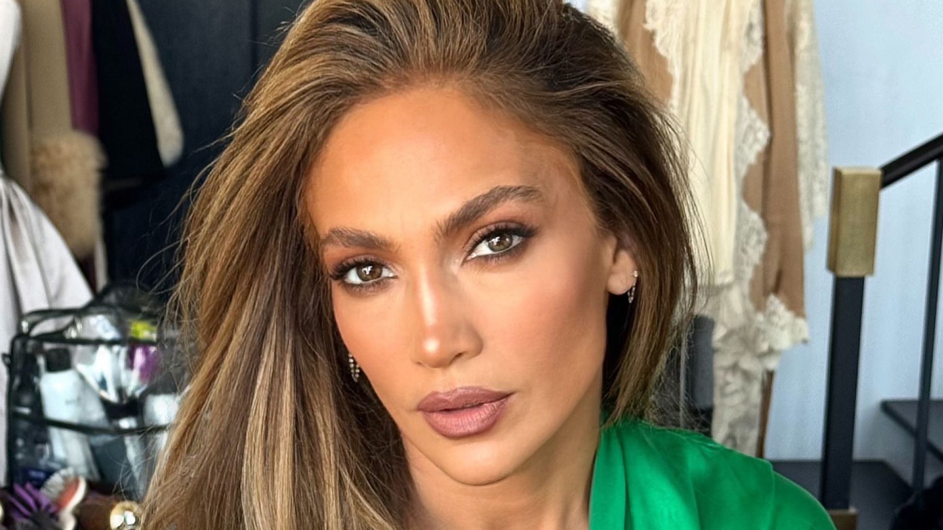 Jennifer Lopez poses in a green robe on her Insatgram