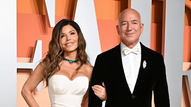 photo of lauren sanchez wearing white gown and jeff bezos in black tux at vanity fair oscars party