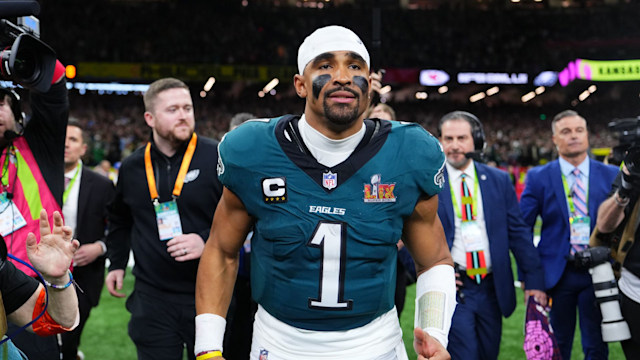 jalen hurts on field after super bowl win
