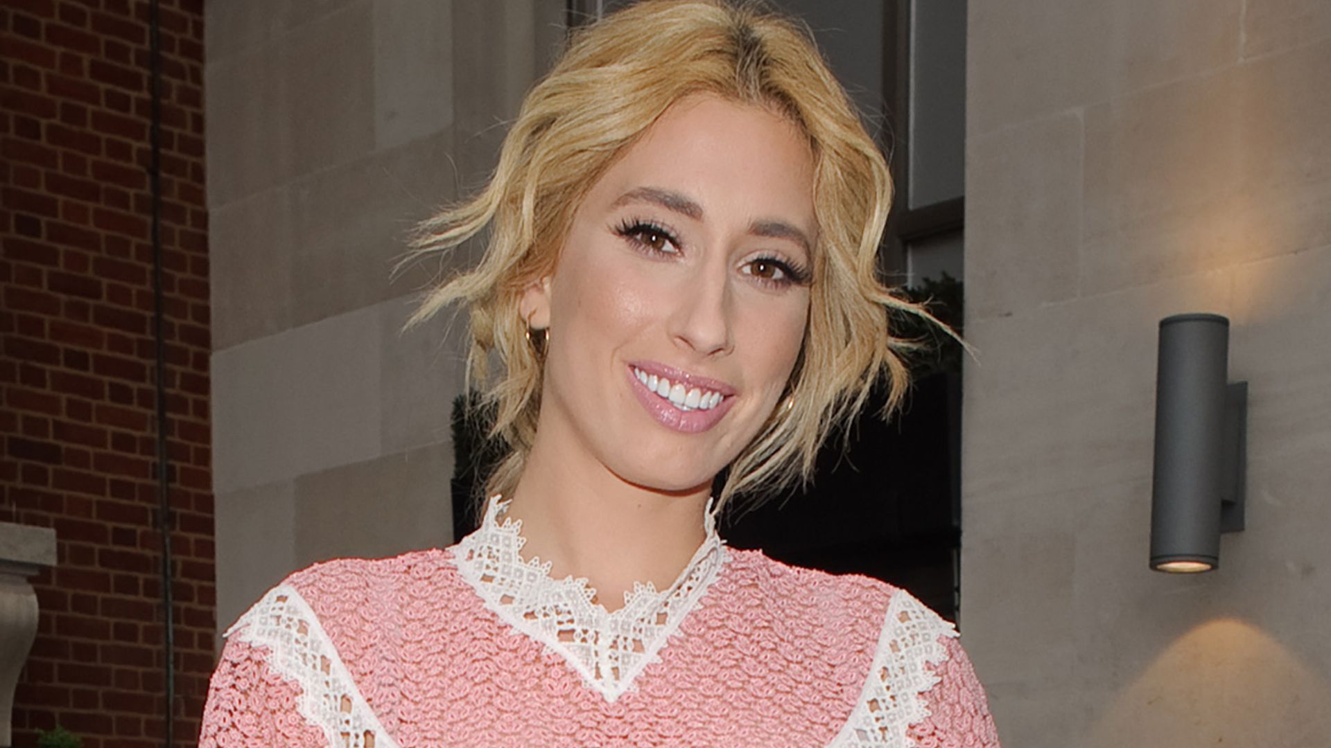 Stacey Solomon wearing pink top with lace trim
