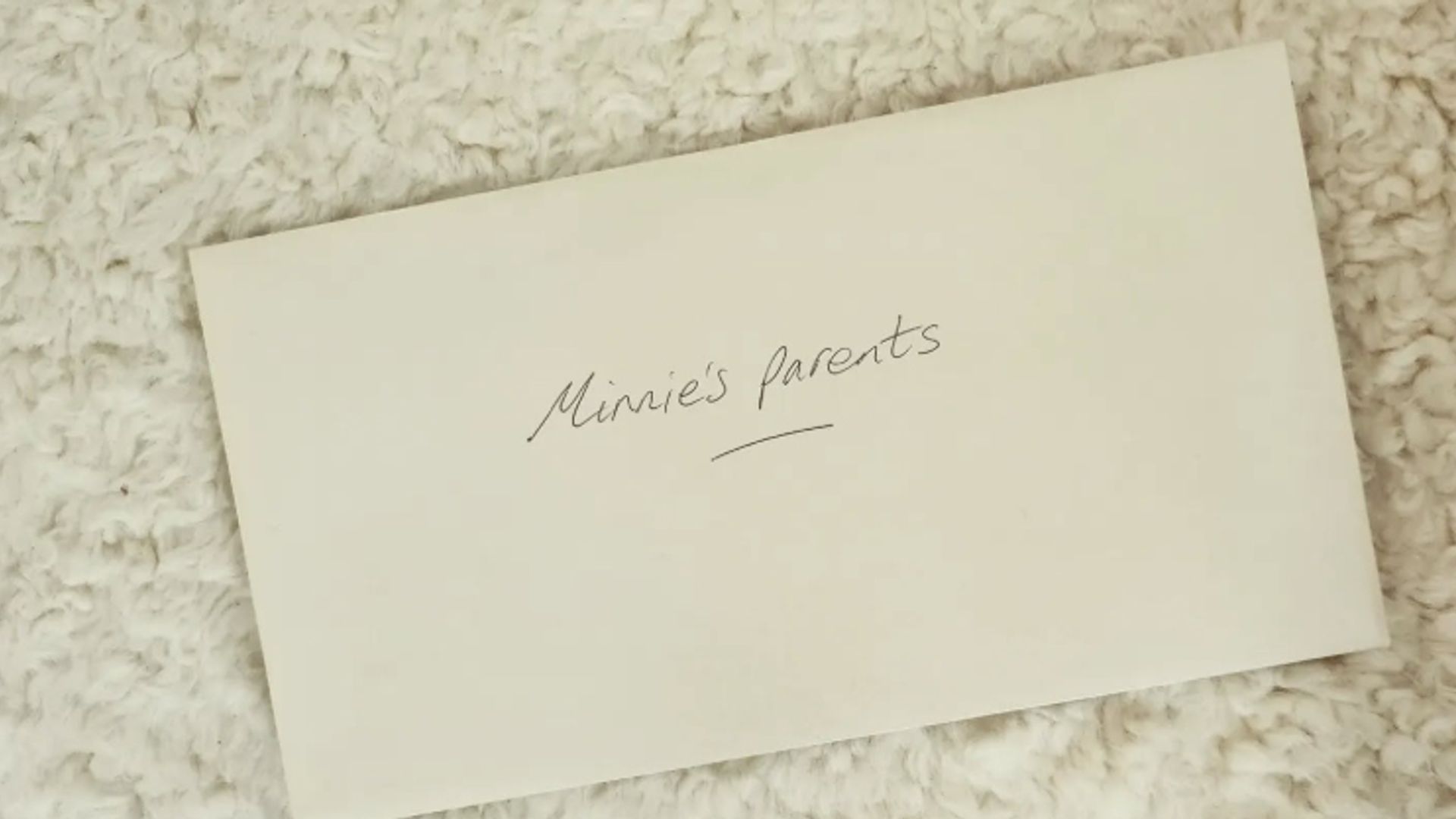 An envelope saying 'Minnie's parents'