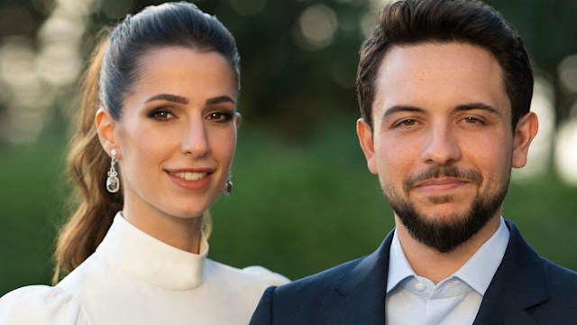 Jordan's Crown Prince Hussein in a suit with his fiancee Rajwa Al Saif wearing a white dress