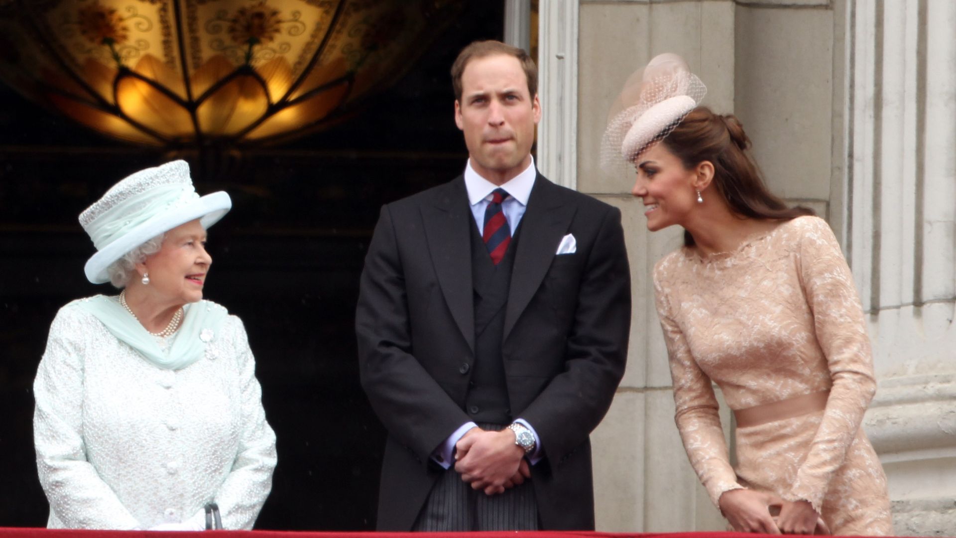 The Queen speaking with Kate Middleton and Prince William at her Diamond Jubilee