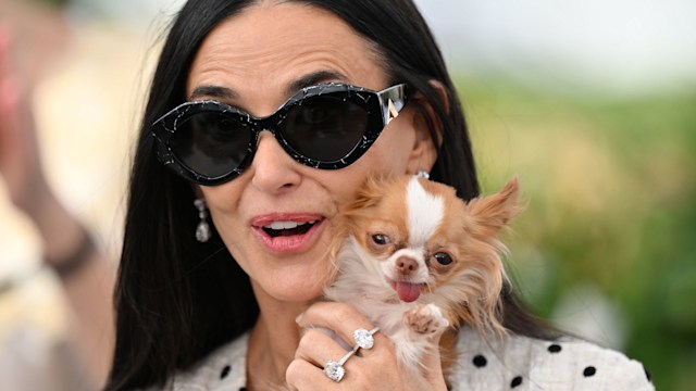 Demi Moore poses with her Chihuahua held up to her face