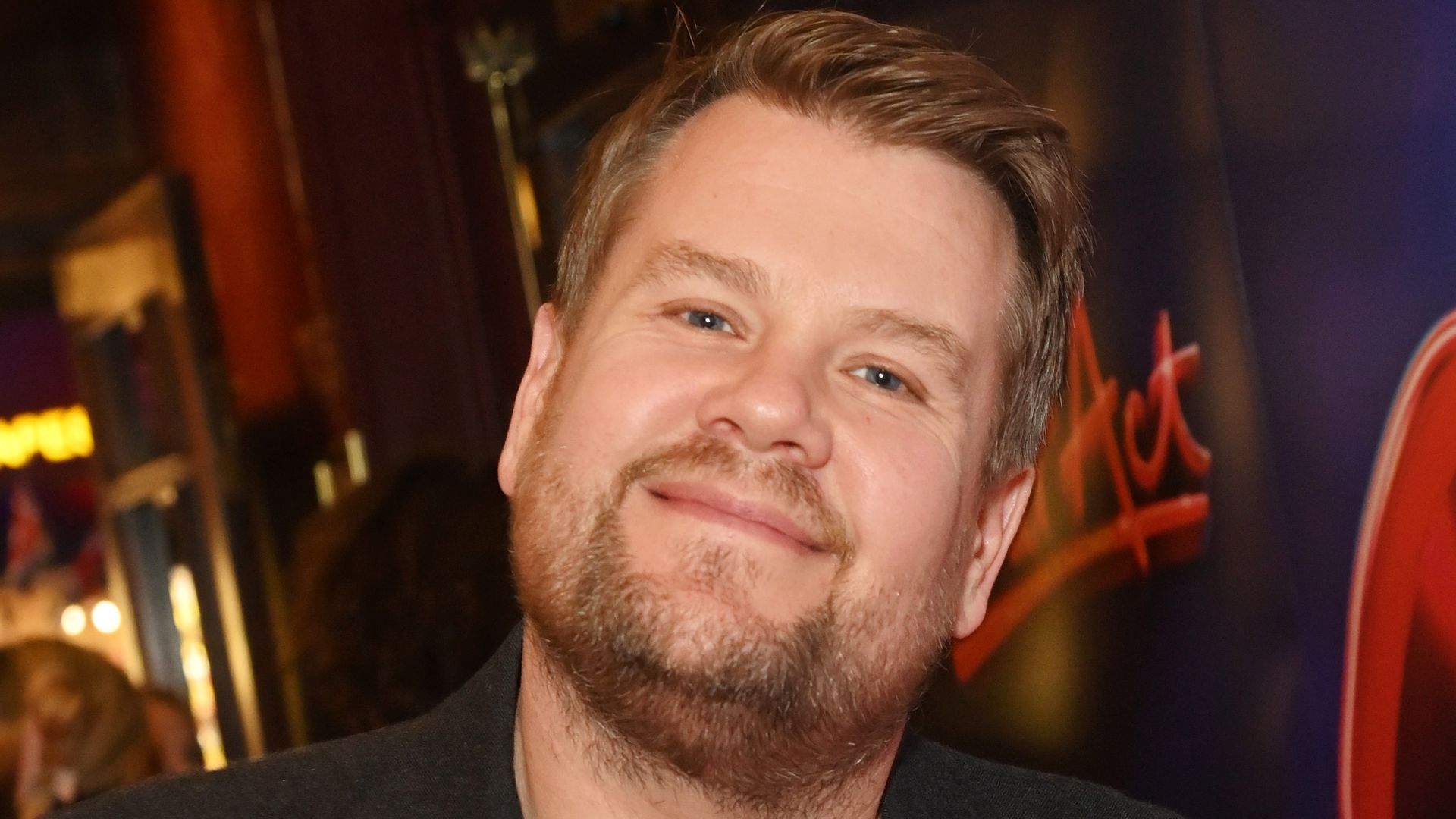 James Corden in a black jacket and shirt