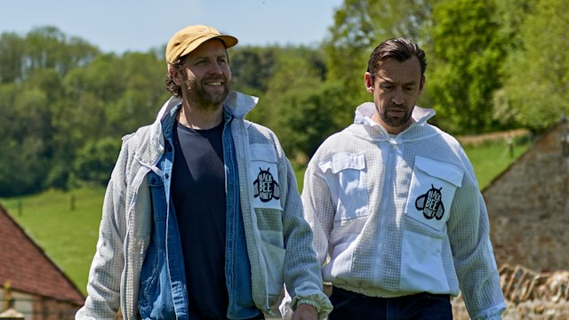 Two men beekeeping