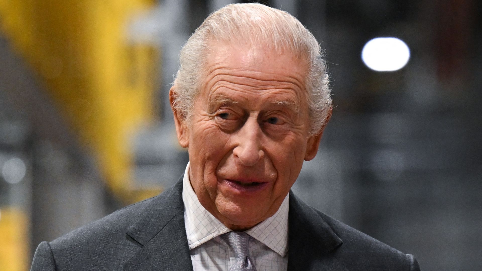Britain's King Charles III chats with Chief of Staff, Rob Holmes during a visit to officially open the South Wales Metro Depot in the South Wales town of Taff's Well on November 14, 2025, as the king marks his 77th birthday. (Photo by Finnbarr Webster / POOL / AFP) (Photo by FINNBARR WEBSTER/POOL/AFP via Getty Images)          
