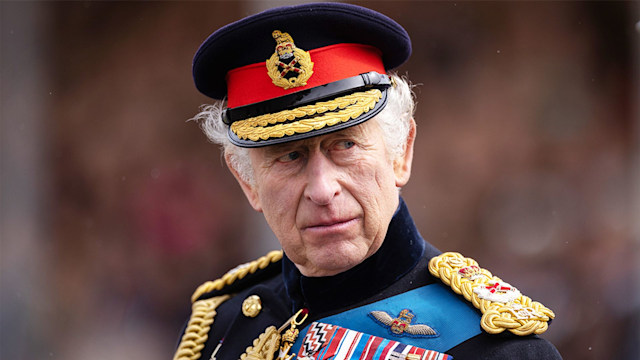 King Charles wearing his military uniform and looking pensive