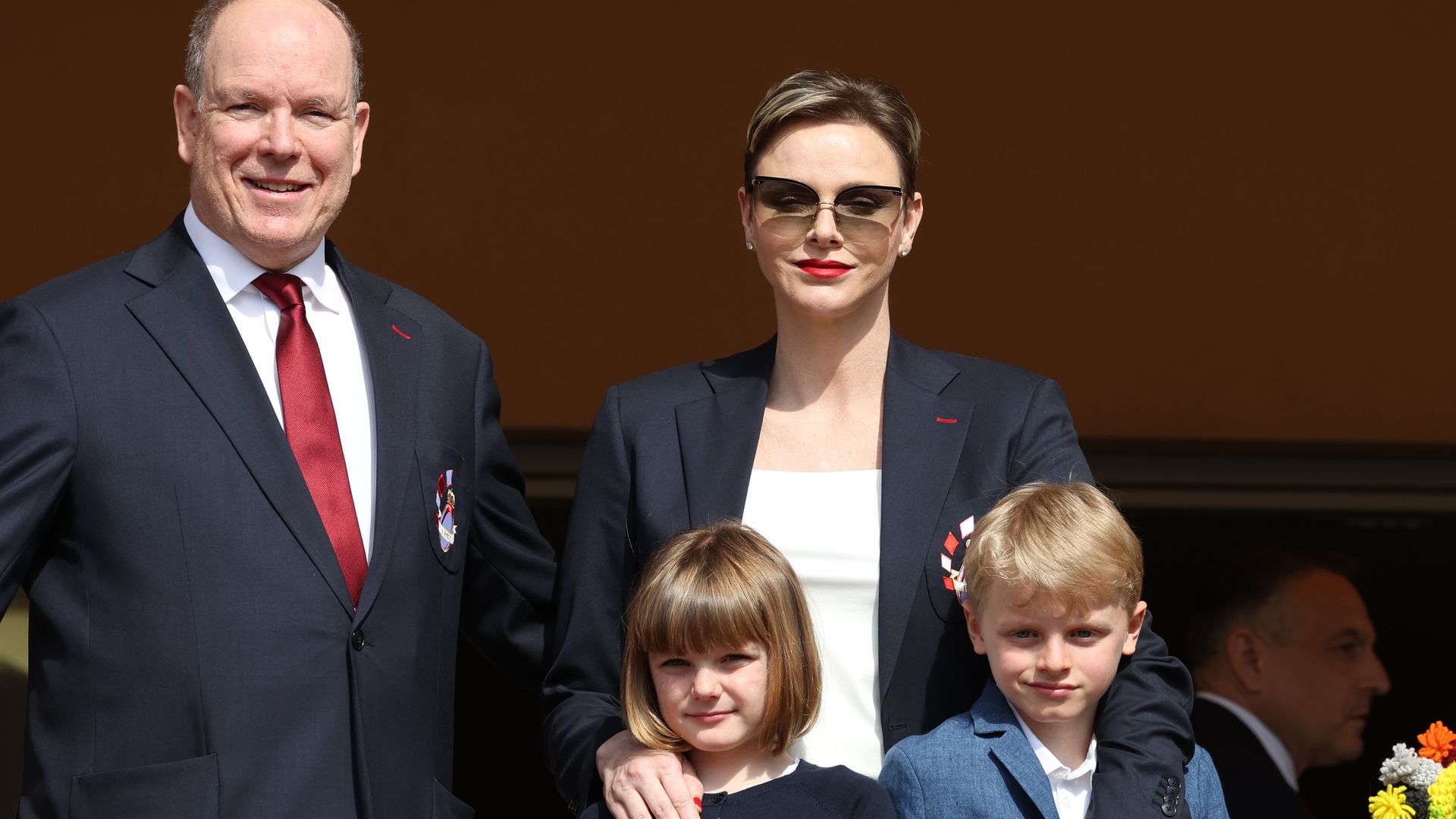 Princess Charlene emerges in figureenhancing dress for family outing