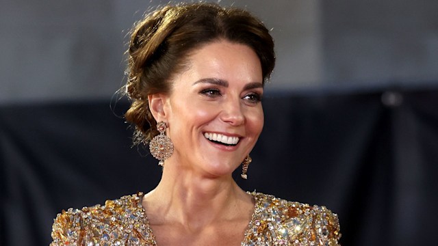 Princess Kate smiling in a gold sparkly dress