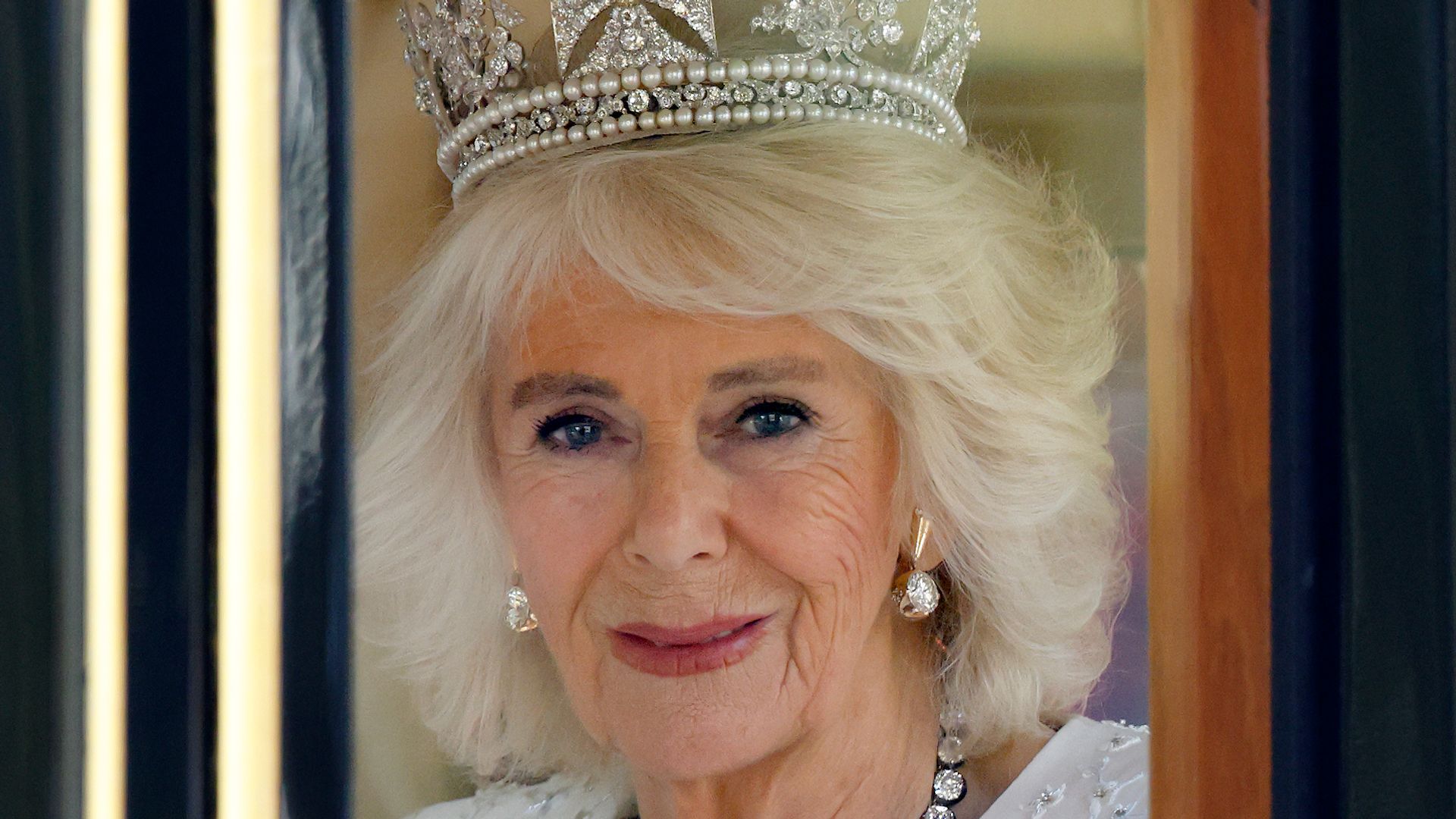 Queen Camilla riding in carriage 