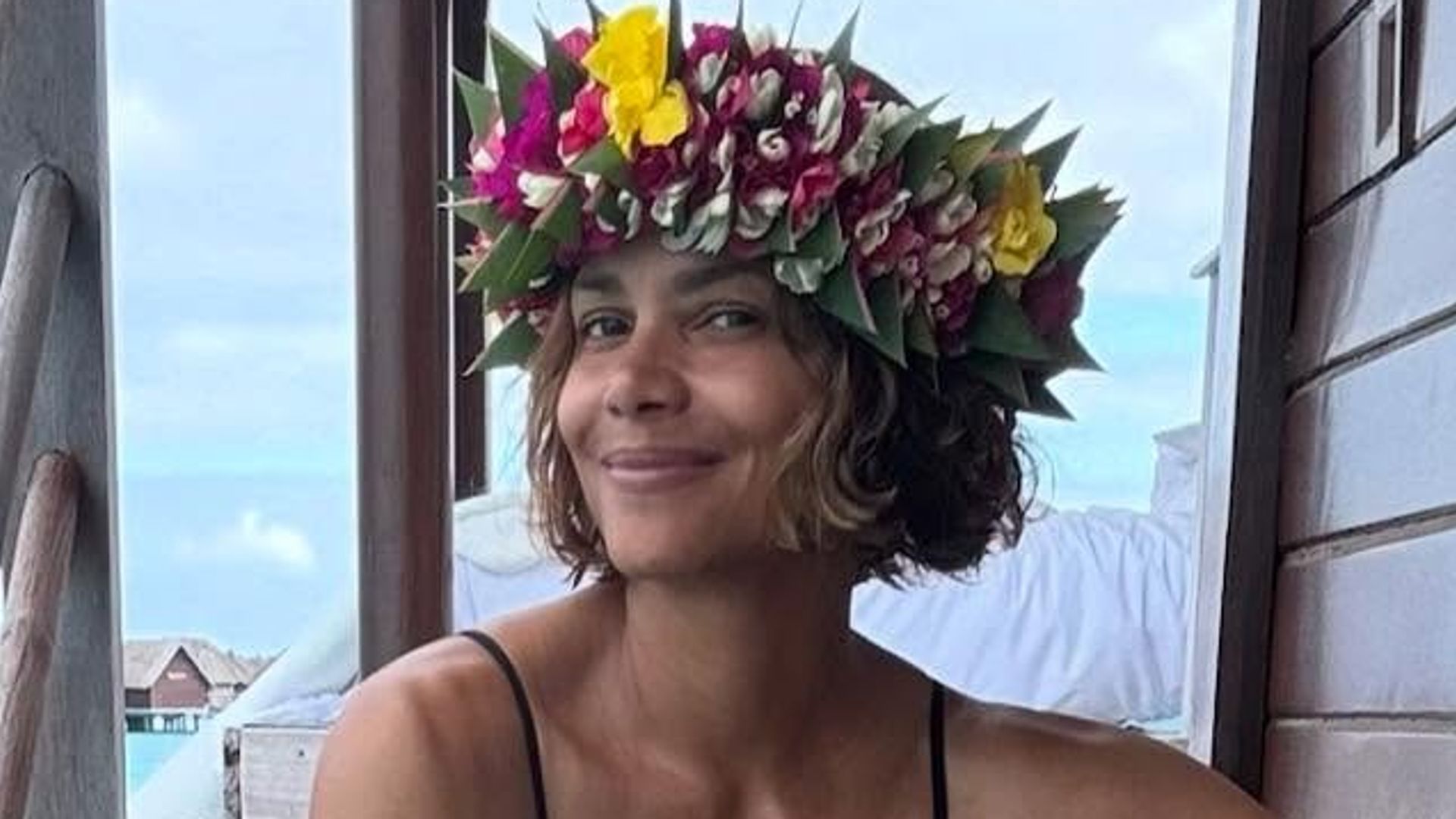 photo of halle berry in black slip and floral headdress