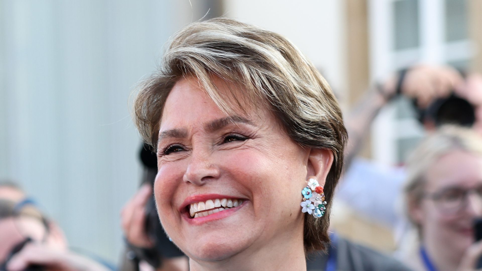 grand duchess maria teresa smiling in blue feathered suit