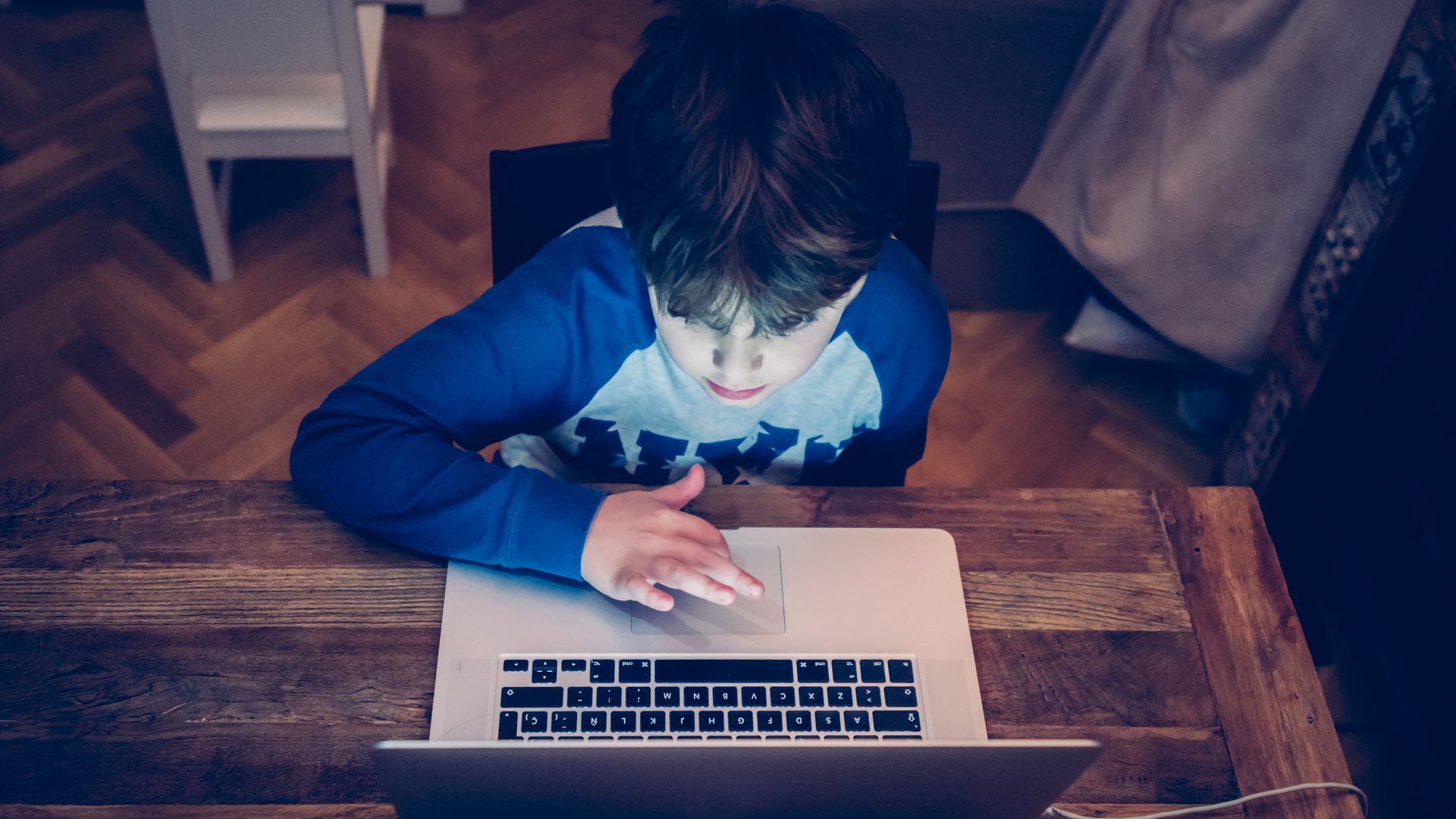 Four years old child studying and learning with a digital tablet