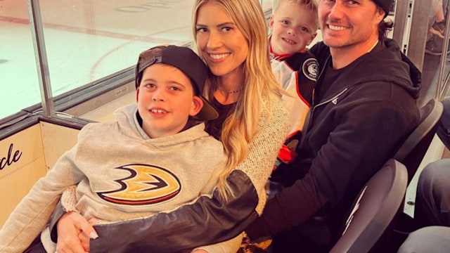 Photo shared by Christina Hall on Instagram November 5 2023 of her with husband Josh Hall with her kids Brayden and Hudson at a hockey game