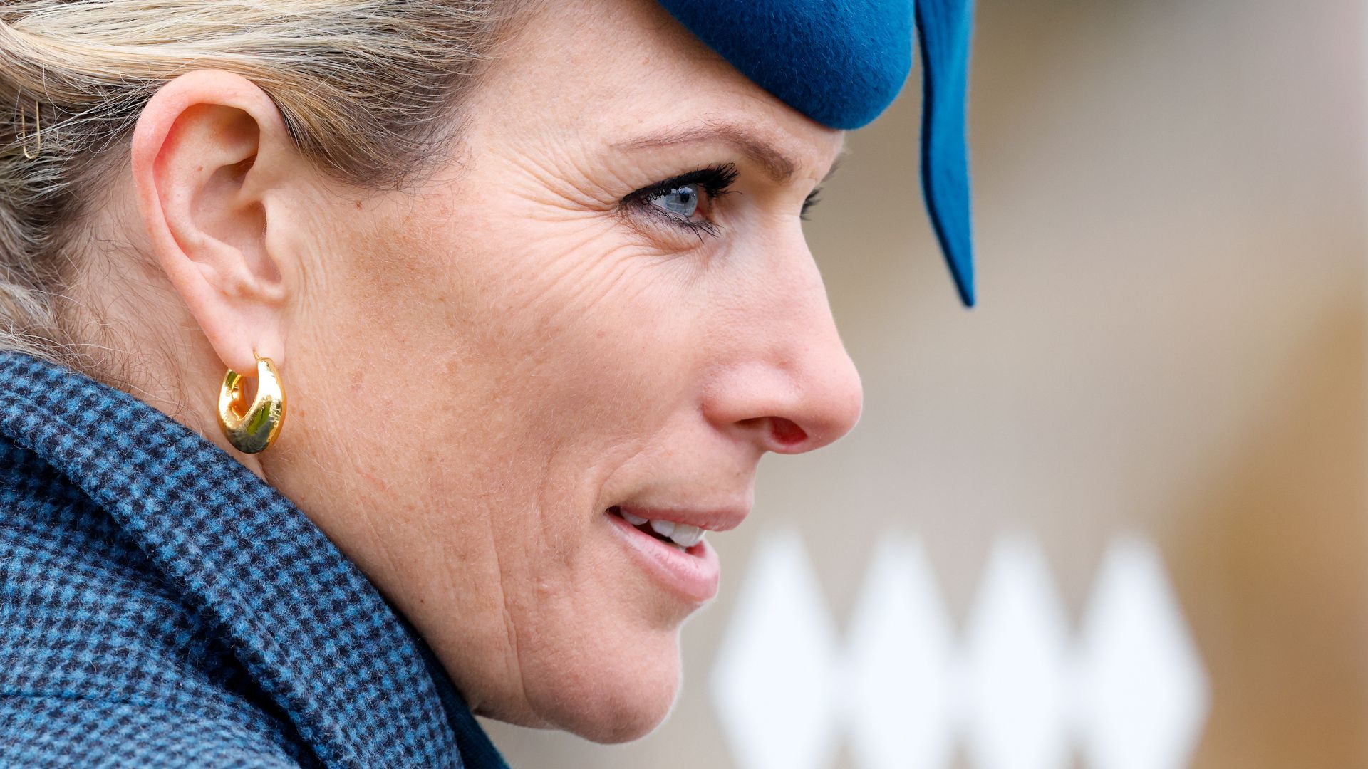 Zara Tindall side profile in a blue hat