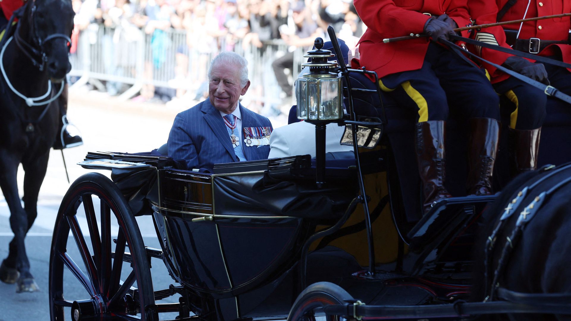 King Charles riding in a carriage