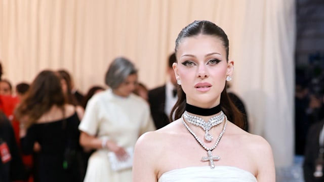 Nicola Peltz Beckham attends The 2023 Met Gala in a white Valentino gown