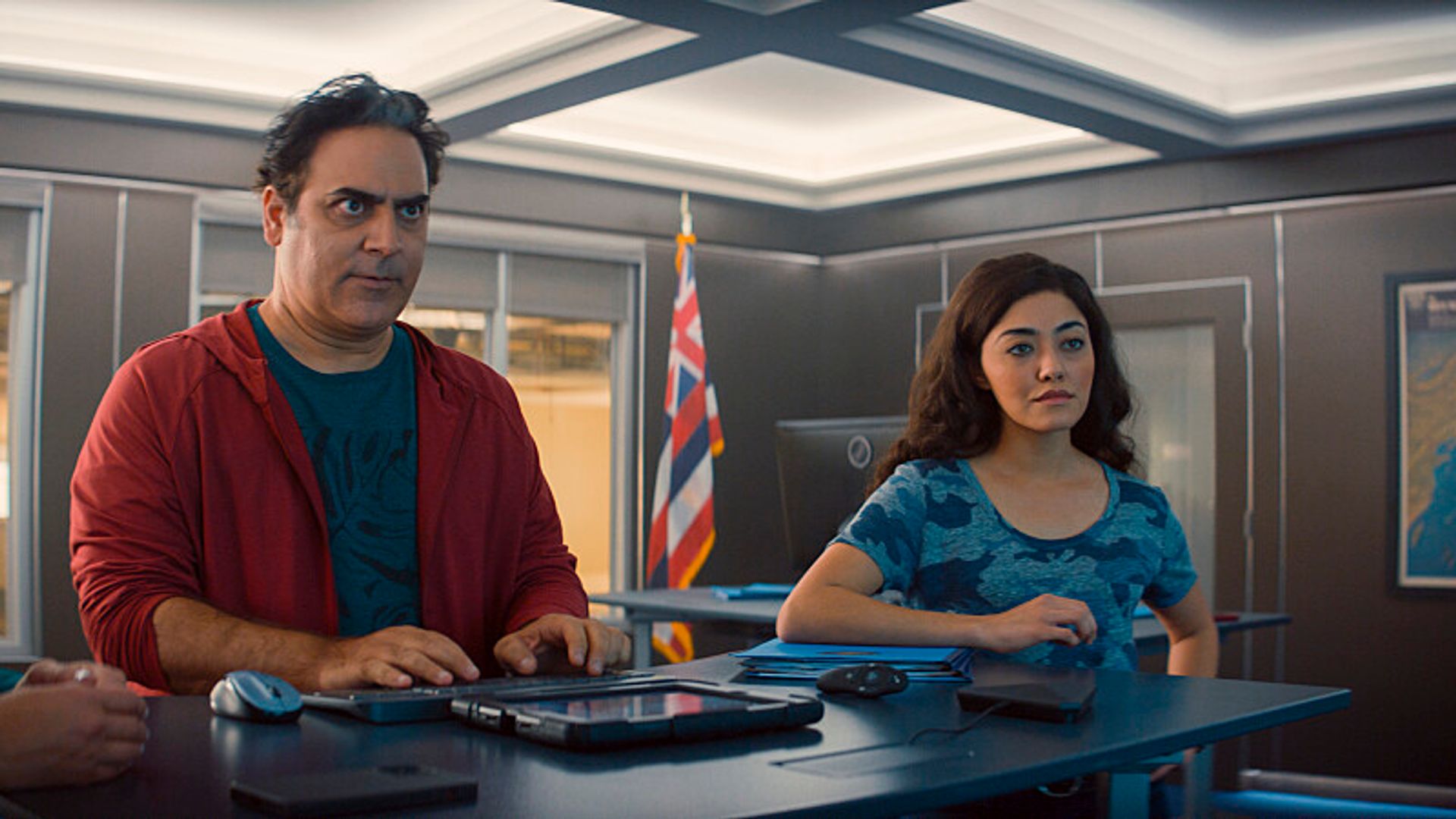 Jason Antoon as Ernie Malik and Yasmine Al-Bustami as Lucy Tara in NCIS: Hawai'i