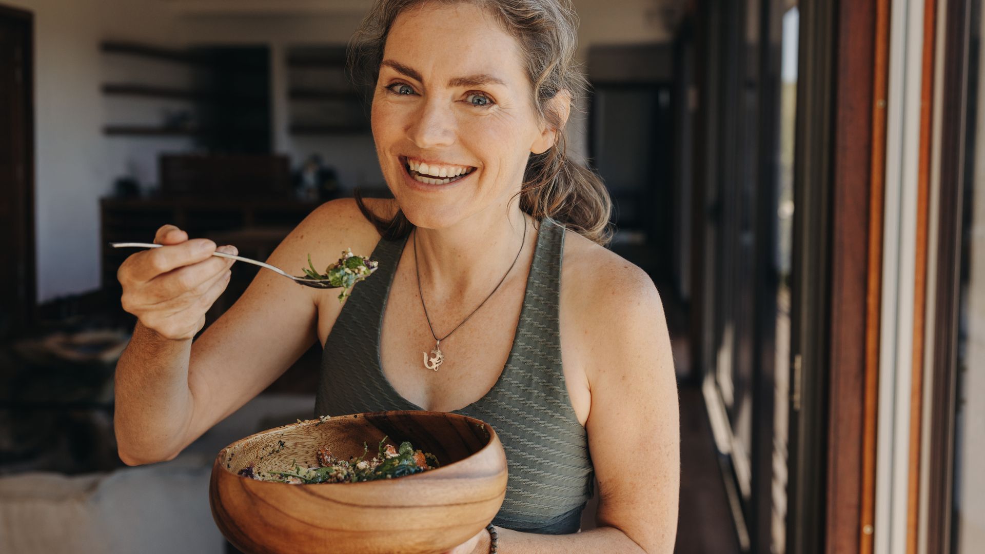older woman eating salad