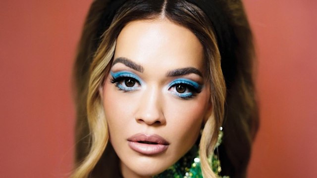 Rita Ora poses in a sequin mini dress and blue eye makeup look on her Instagram