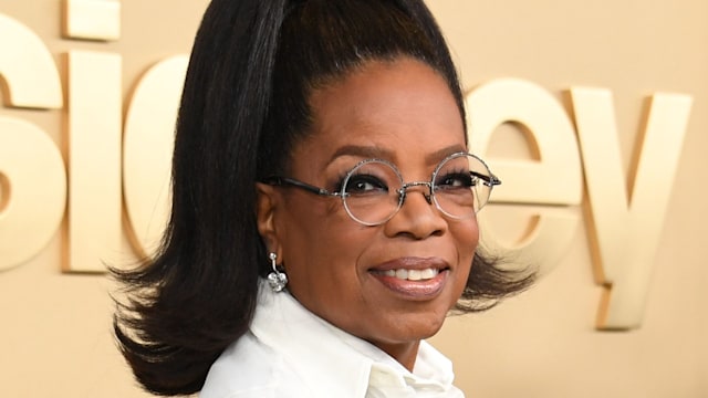 Oprah wearing a white top