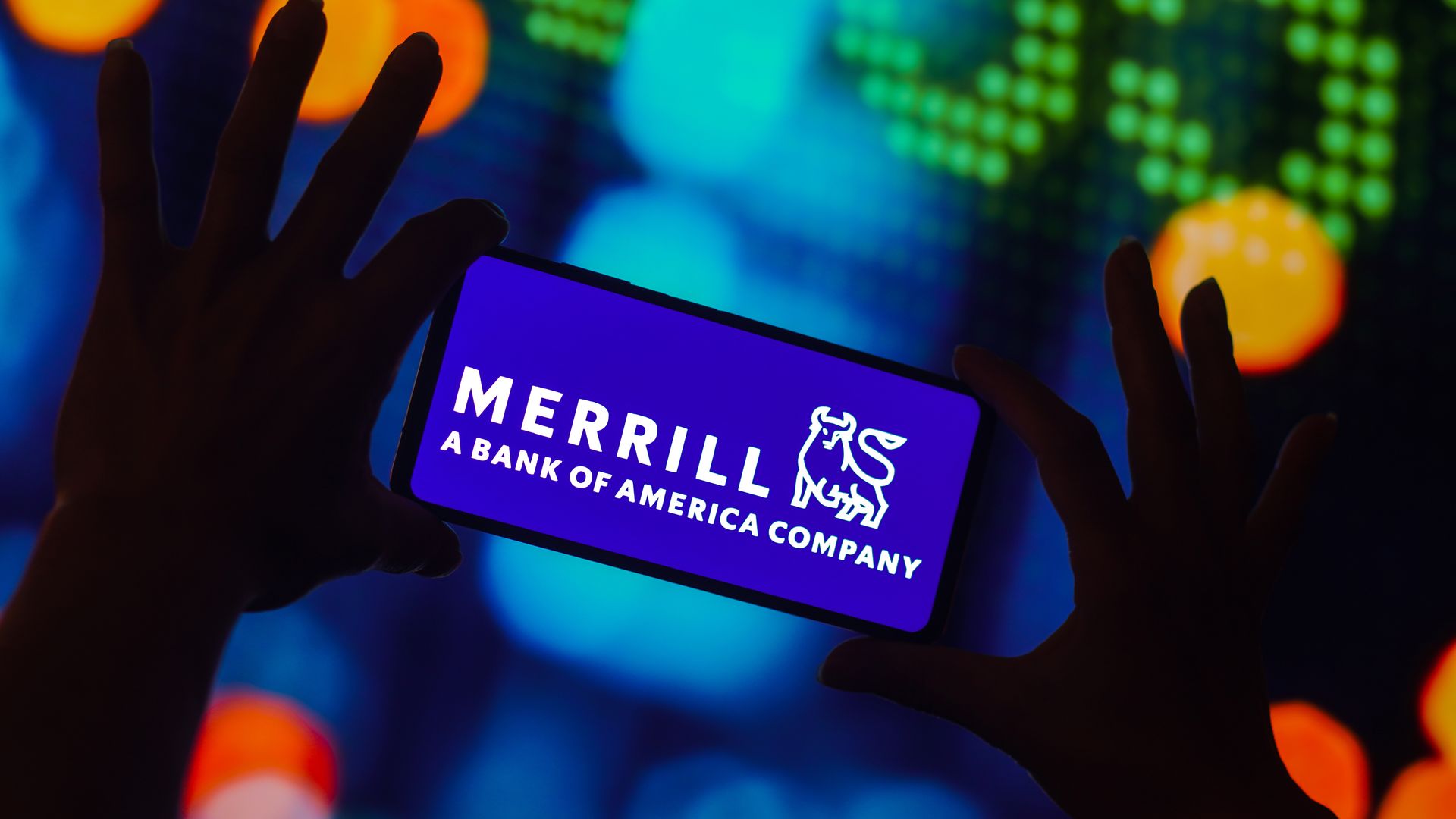 A phone displaying the Merrill logo