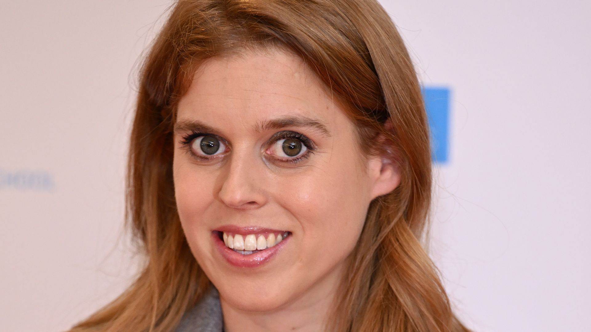Princess Beatrice in grey jacket