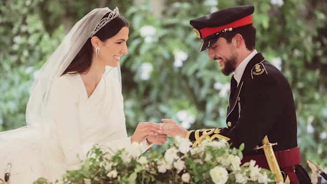 Crown Prince Al Hussein and his bride Rajwa Al Saif exchange rings during the wedding ceremony