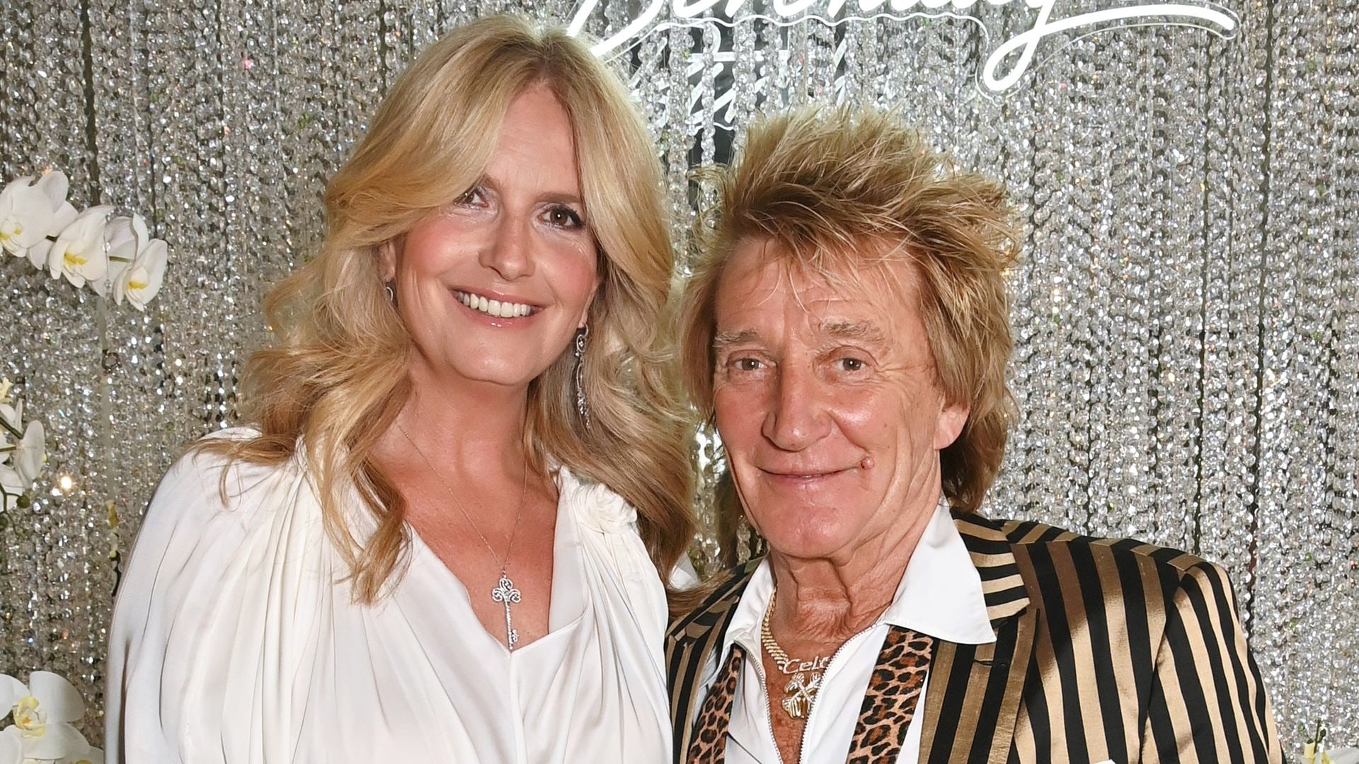 Penny Lancaster and Rod Stewart posing together