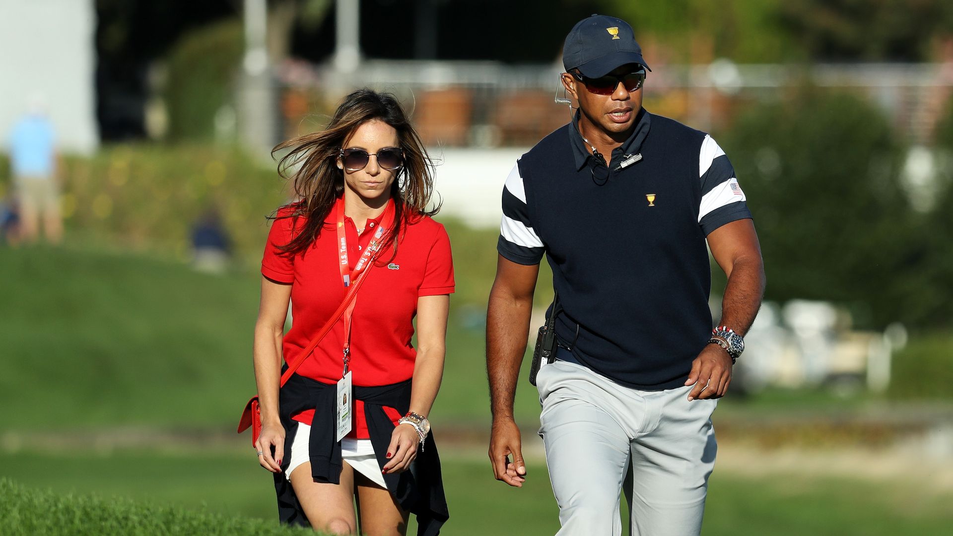 Tiger Woods and Erica Herman walking on golf course