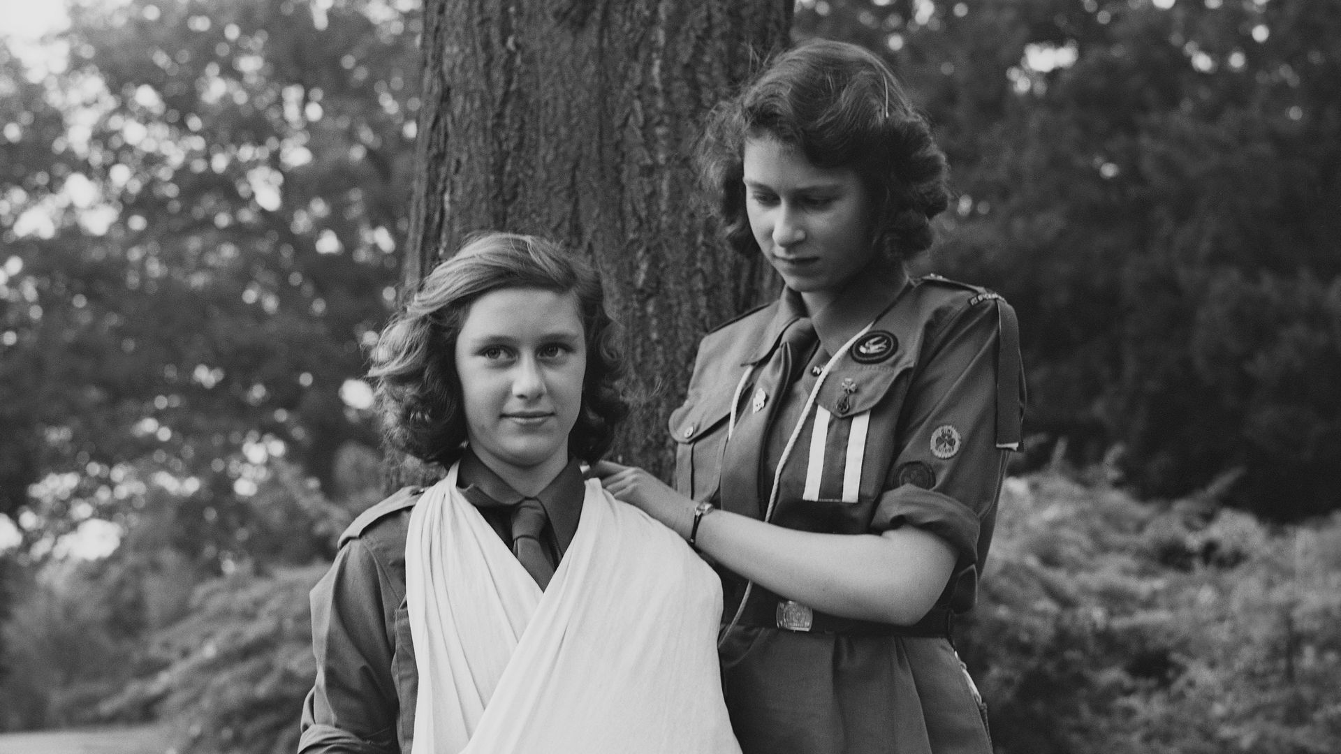 The Queen putting Princess Margaret in an arm sling