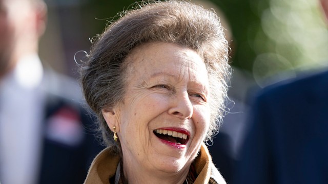 woman laughing outside in wool coat