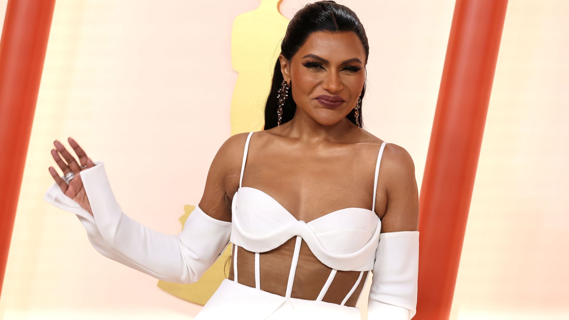Mindy Kaling in a strappy white top