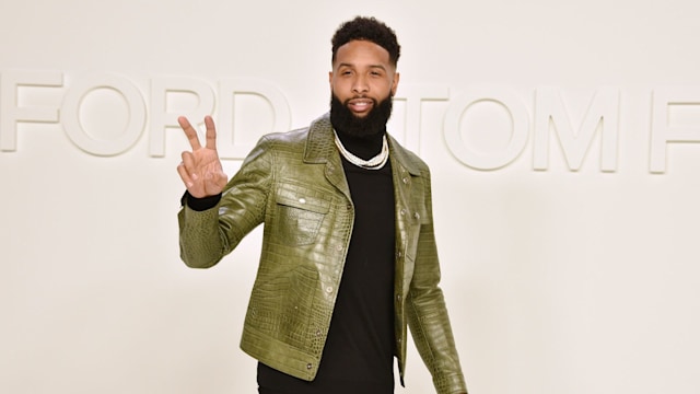 Odell Beckham Jr. attends the Tom Ford AW/20 Fashion Show wearinga black turtle neck and green crocodile skin jacket