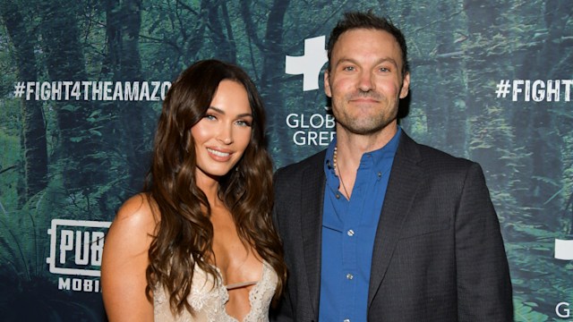 Megan Fox in sheer satin dress and Brian Austin Green on red carpet