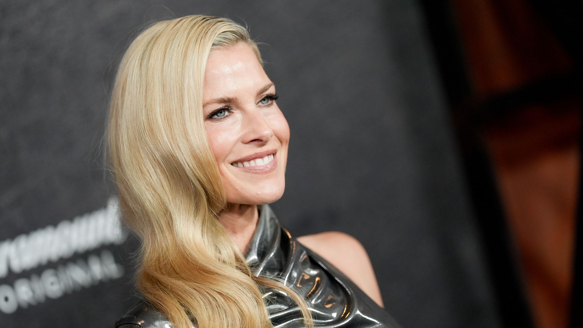 Ali Larter smiling and glam in silver dress 