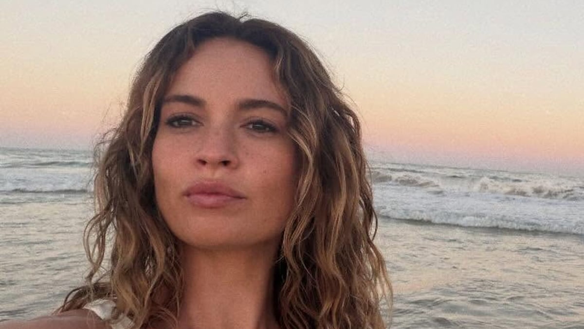 Lily James is the ultimate holiday bombshell in barely-there bikini and sea-drenched hair