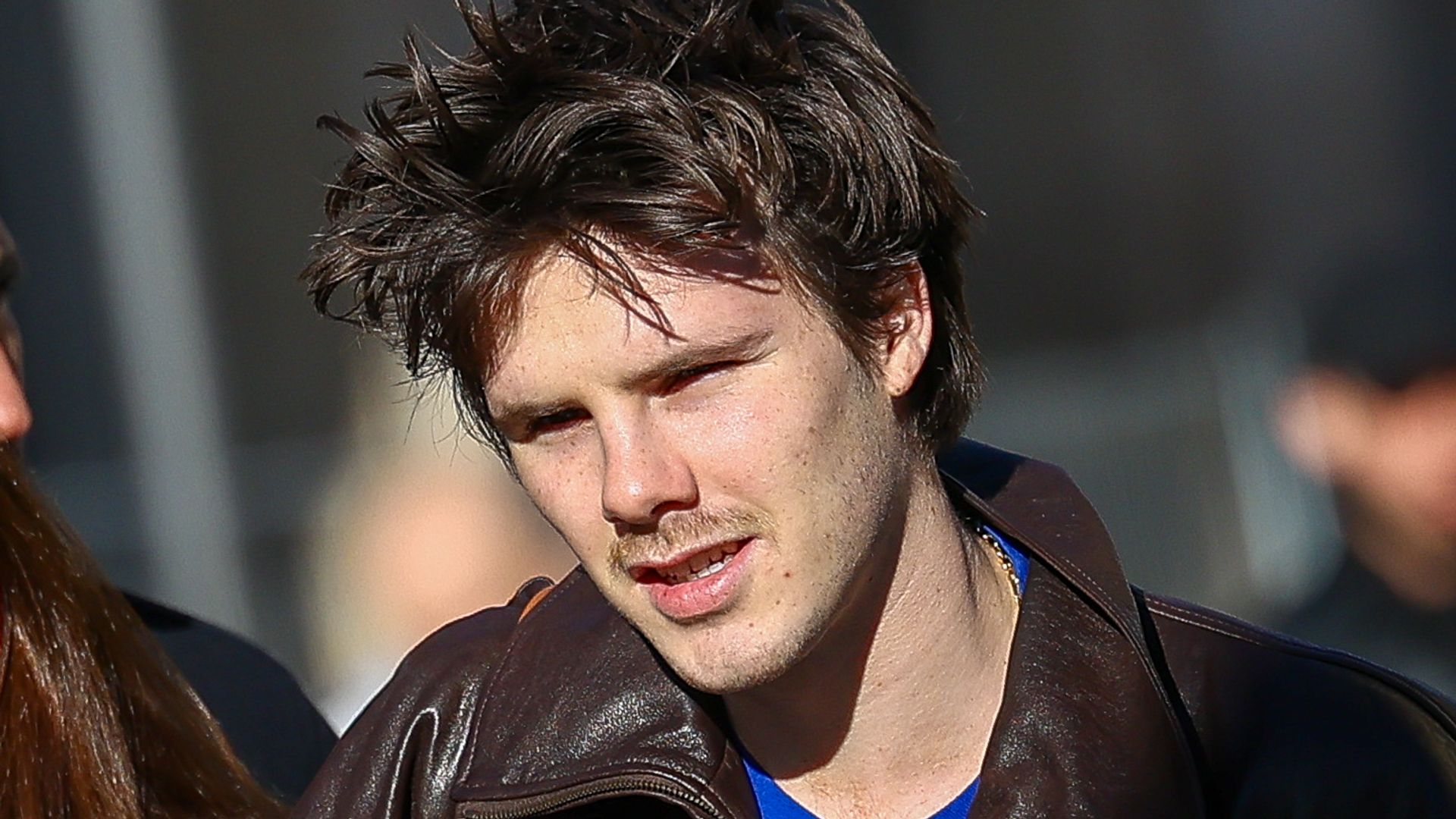 Cruz Beckham wearing a superman T-shirt