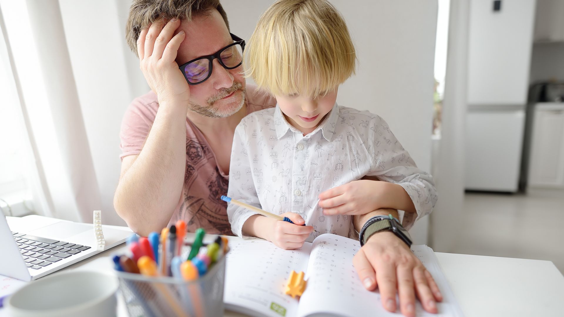 Tired dad helps his child