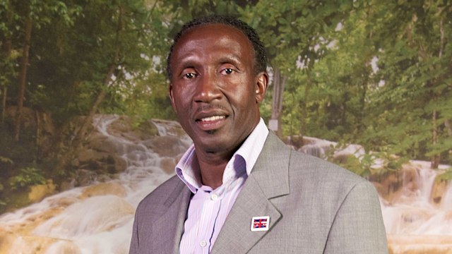 Linford Christie in a grey suit